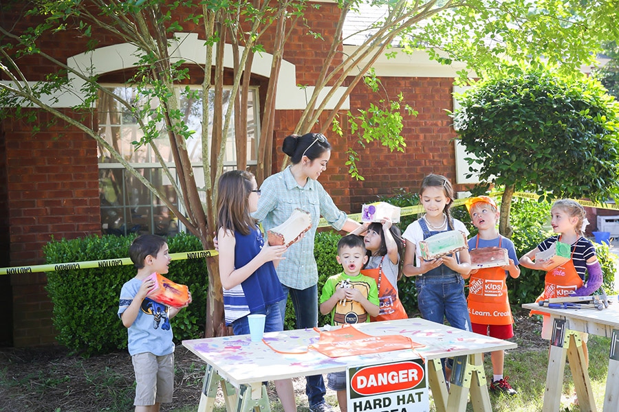 What a fun construction themed birthday party! Kids can build things with workshop kits from Home Depot!