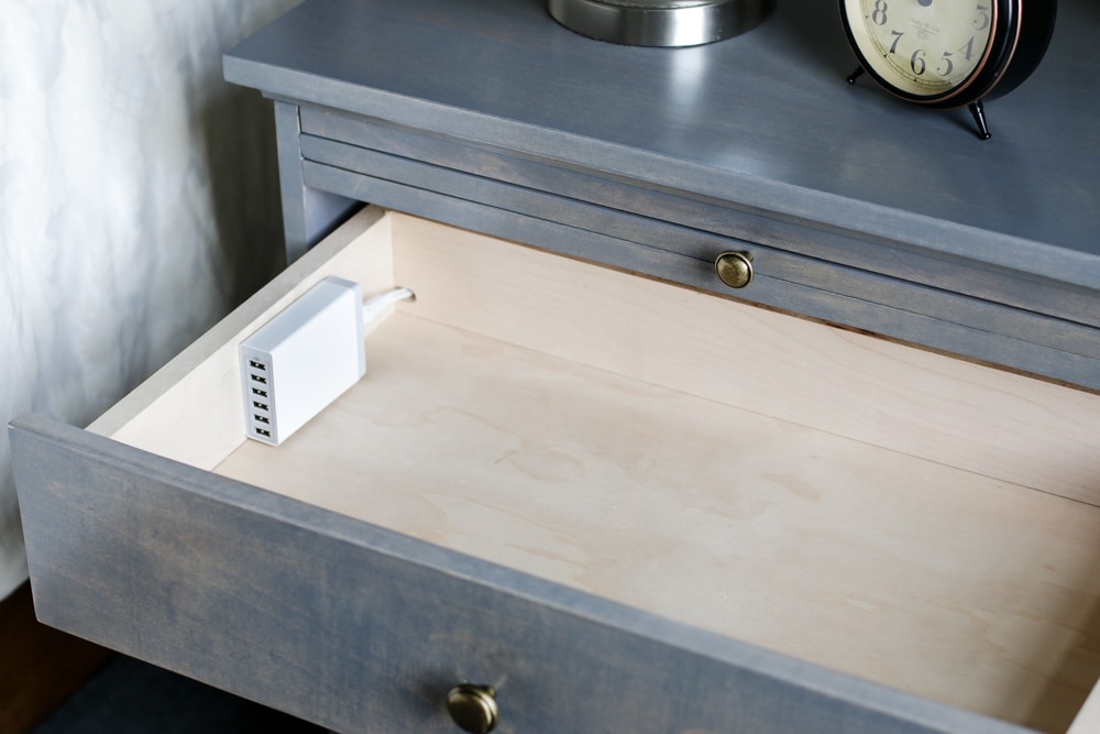 Genius! LOVE this DIY nightstand with built-in charging station and pull-out writing tray. Free plans by Jen Woodhouse