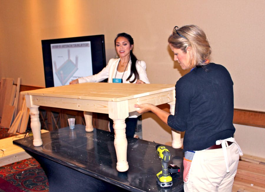 Jen Woodhouse and Jaime Costiglio build a coffee table at the Haven Conference