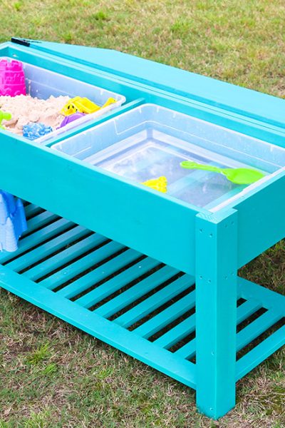 Learn how to make a fun DIY sand and water table for your kiddos! The perfect summer project that keeps your little ones playing outside. Free building plans by Jen Woodhouse
