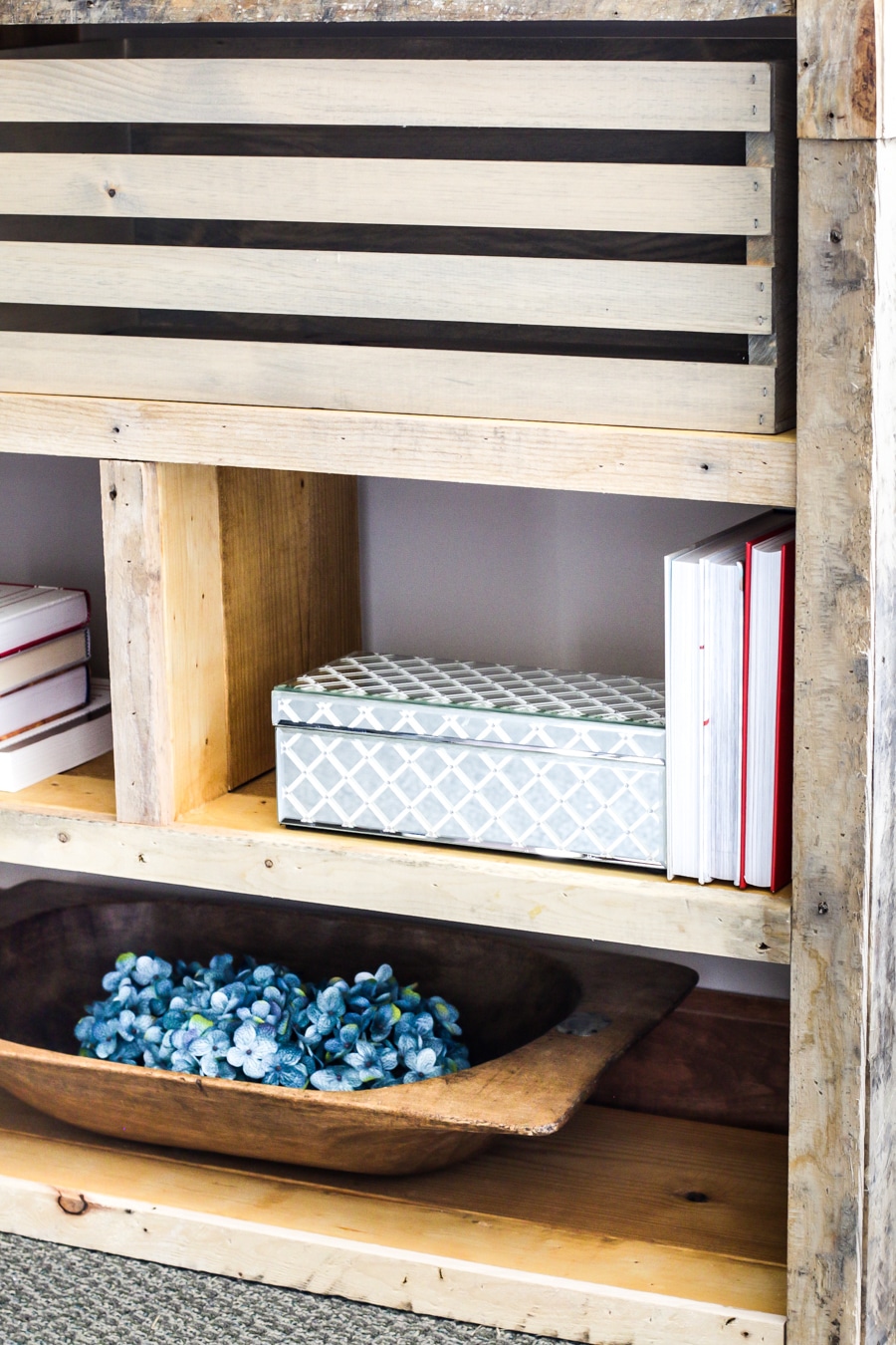 Bookshelf with crates and pallets