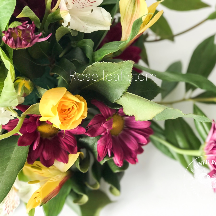 Designer centerpiece using grocery store flowers and garden scraps