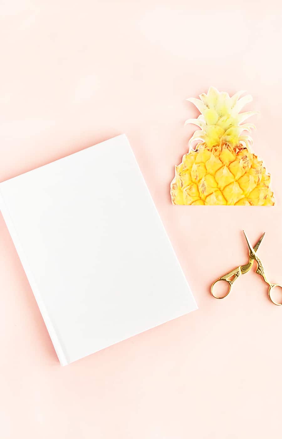 DIY Pineapple Notebook - Create your own tropical stationery with this tutorial using printable temporary tattoo paper. Click through for the how-to!