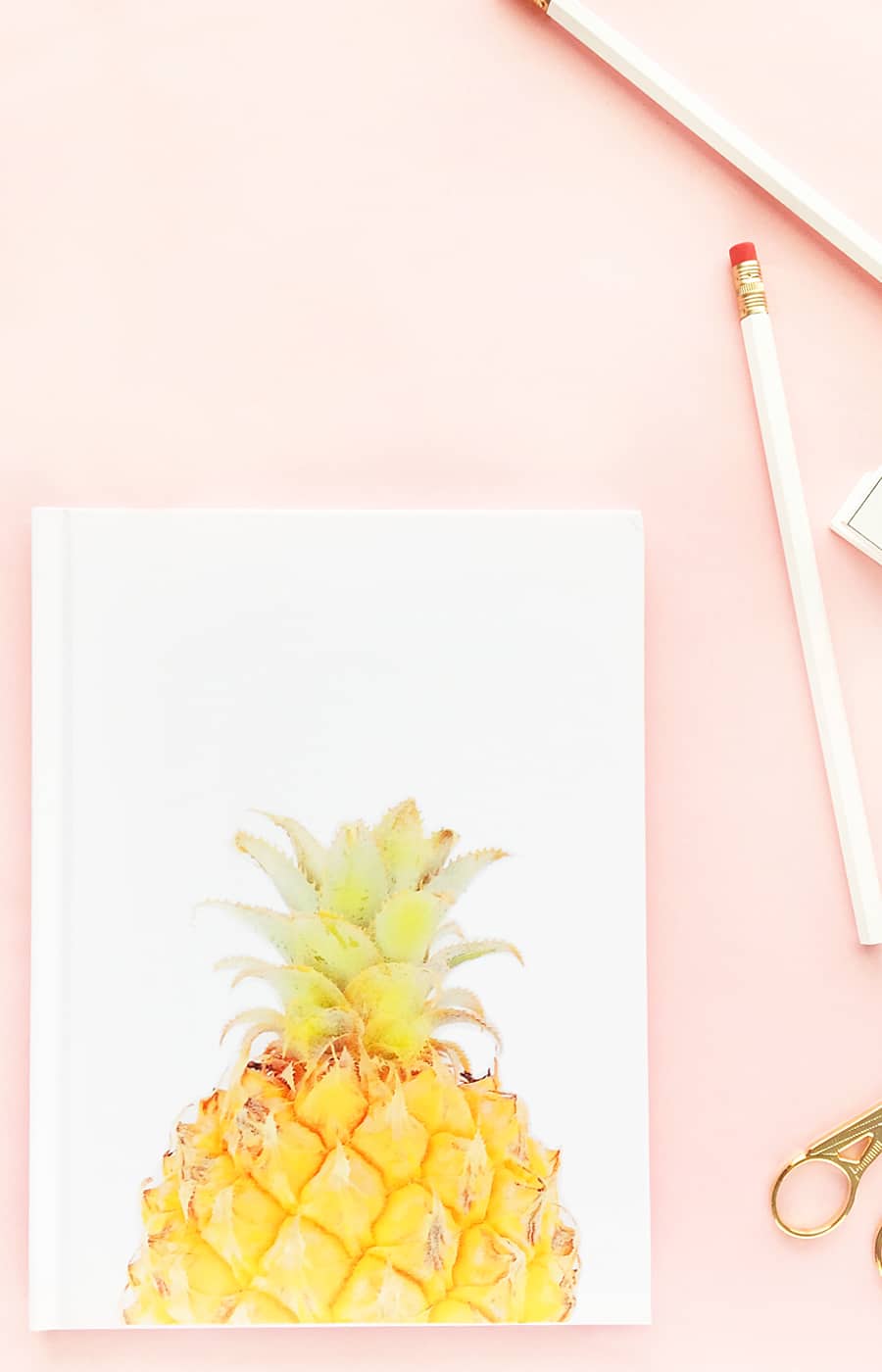 DIY Pineapple Notebook - Create your own tropical stationery with this tutorial using printable temporary tattoo paper. Click through for the how-to!