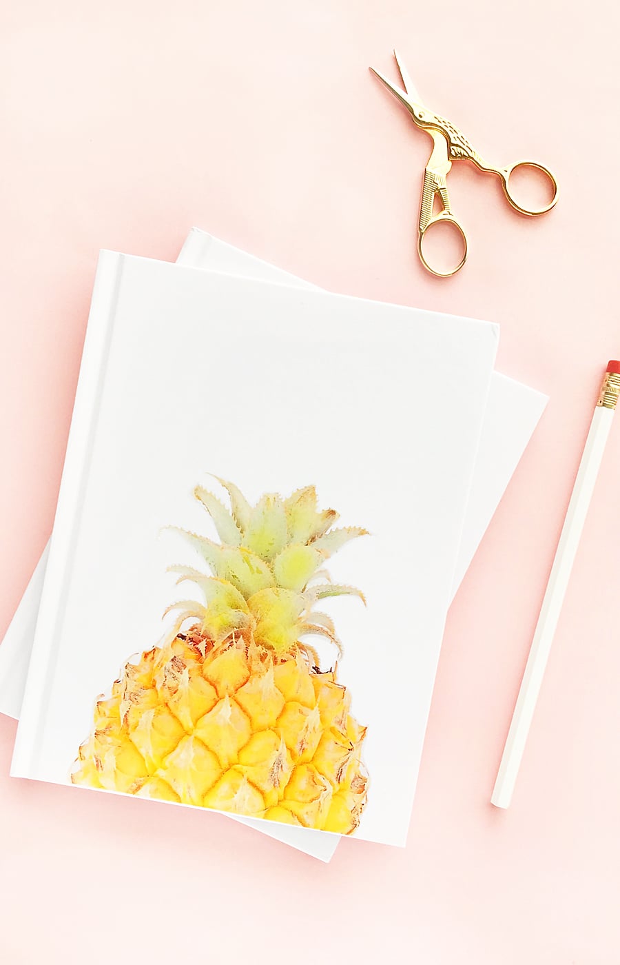 DIY Pineapple Notebook - Create your own tropical stationery with this tutorial using printable temporary tattoo paper. Click through for the how-to!