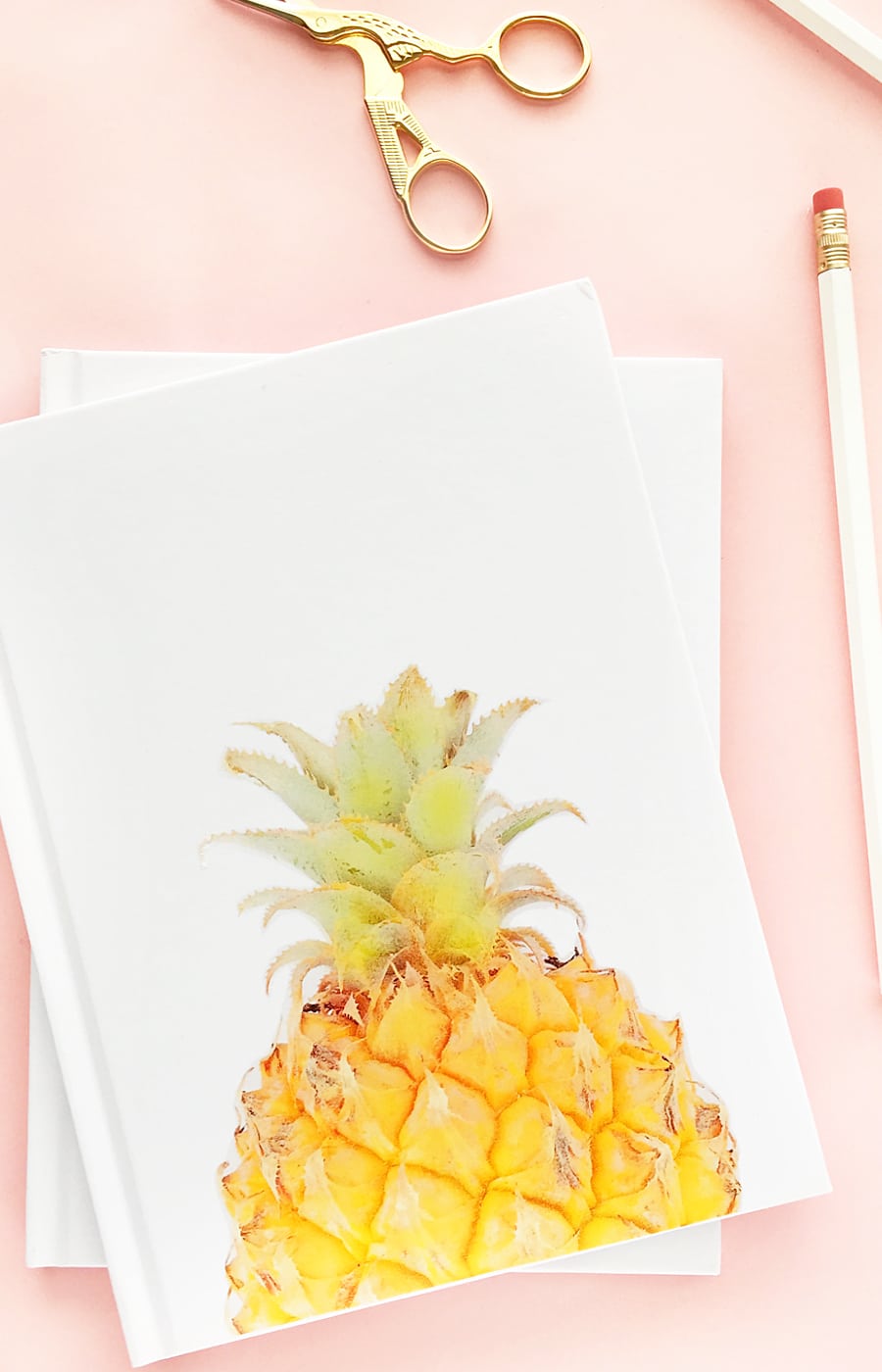 DIY Pineapple Notebook - Create your own tropical stationery with this tutorial using printable temporary tattoo paper. Click through for the how-to!