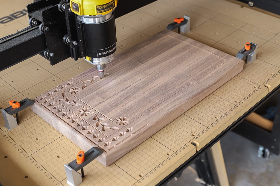 Carving a beautiful pattern into the black walnut cutting board