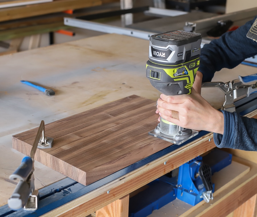 Using the roundover router bit to round the edges of the cutting board