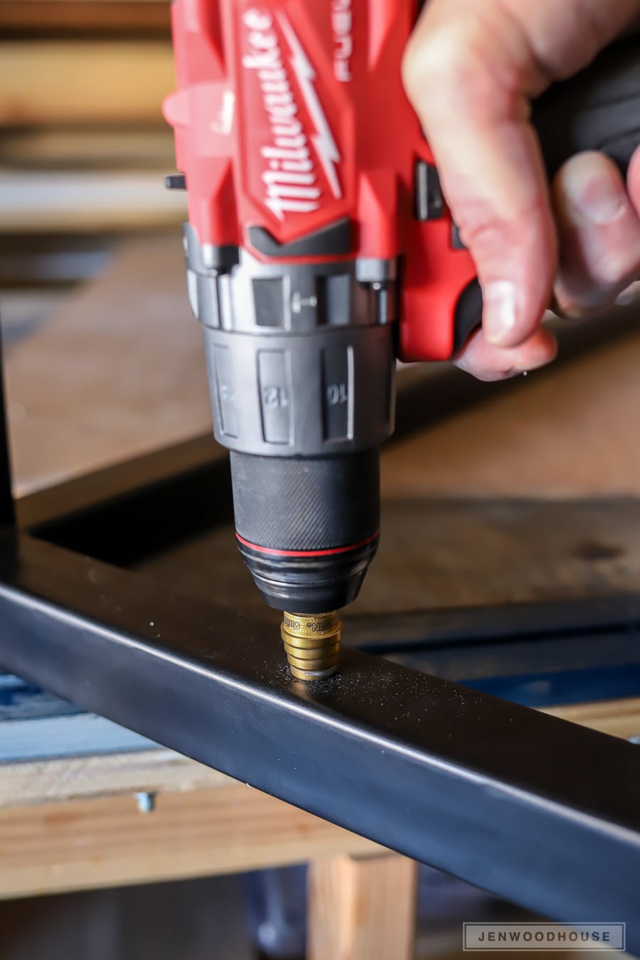 Using a stepped drill bit to drill holes into steel square tubing