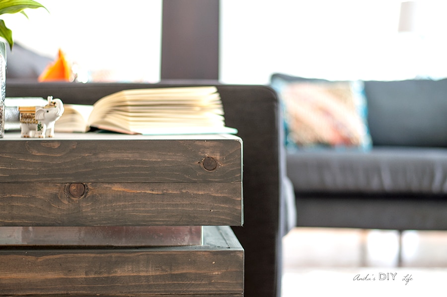 Silver metallic accents on a tiered end table