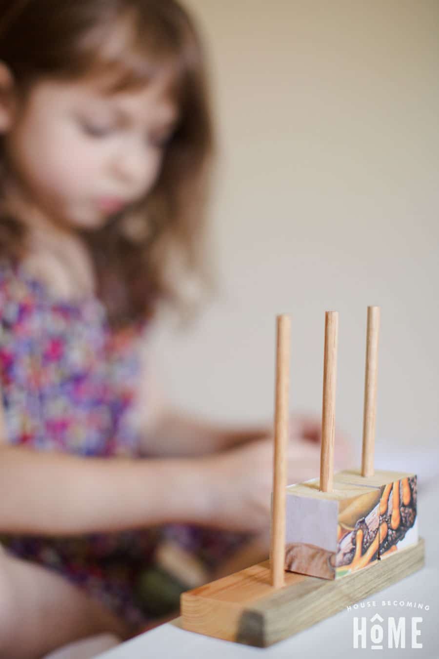 playing with stacking wood puzzle