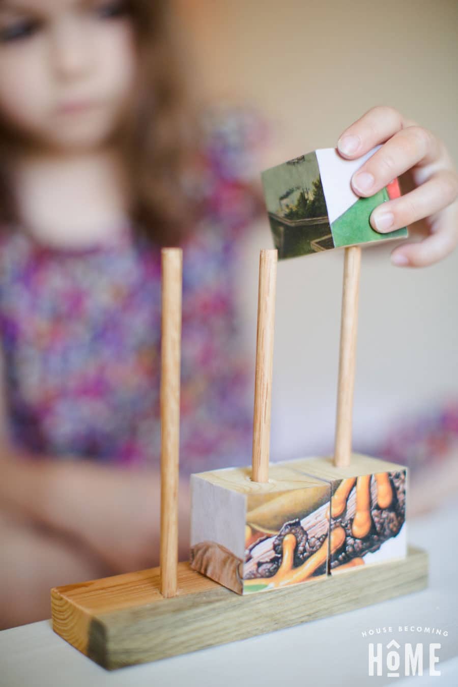 playing with stacking wood puzzle