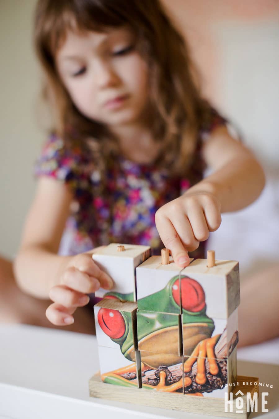 playing with stacking wood puzzle