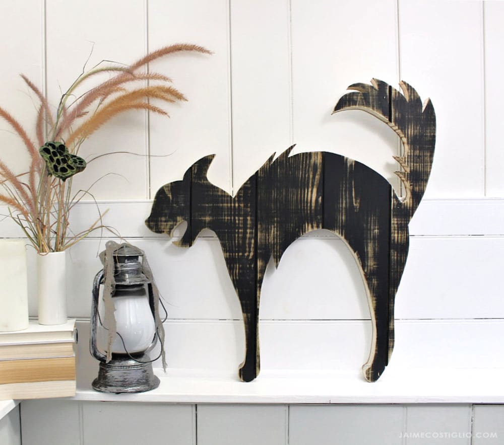 large black cat wood cut out on ledge