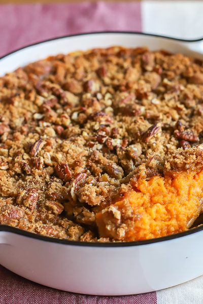 The BEST sweet potato casserole recipe! Creamy and rich sweet potatoes with a crumbly brown sugar pecan crust!