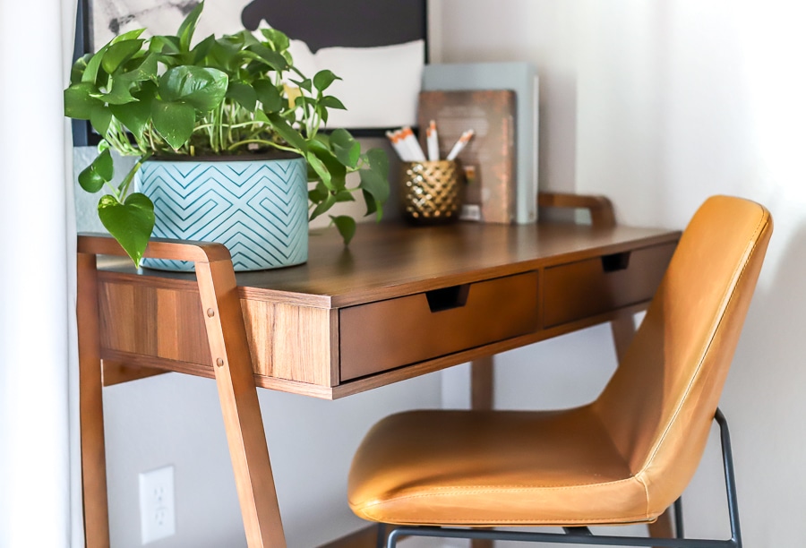 Guest bedroom office area mid-century desk and leather chair