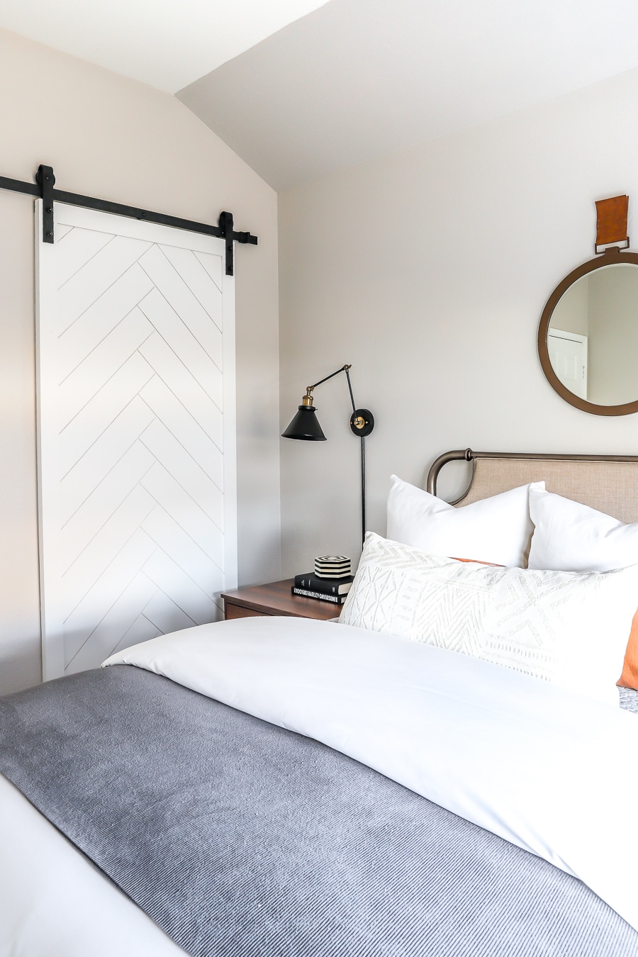 Herringbone sliding barn door in guest room