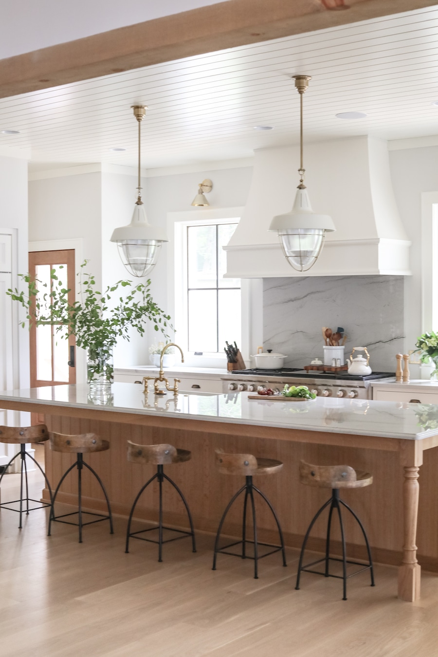 White kitchen with wood island