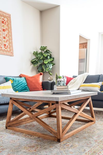 How to build a DIY Angled X Base Coffee Table with a Concrete Top - Free plans!