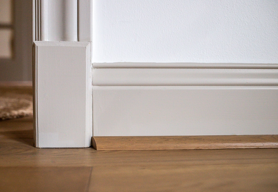 Transition a door casing to baseboard with a plinth block