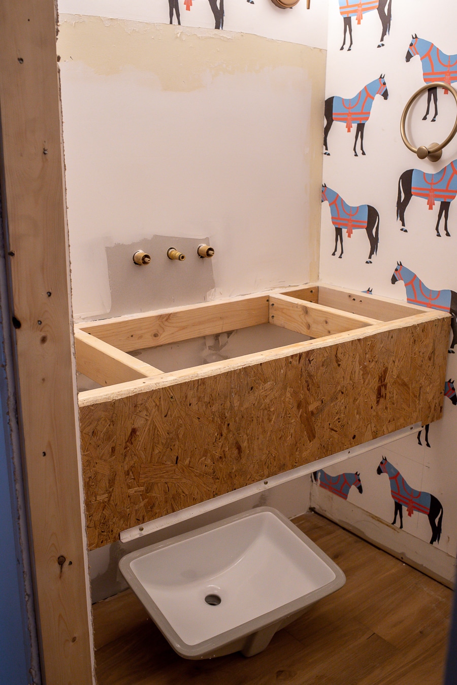 Powder Room Renovation With A Floating Vanity and Statement Wallpaper