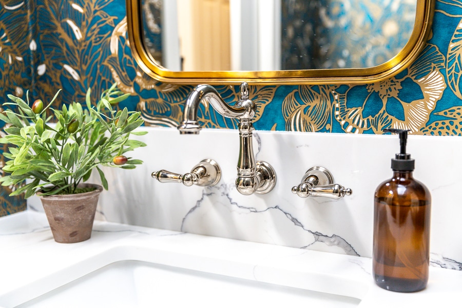 powder room with wall mounted faucet