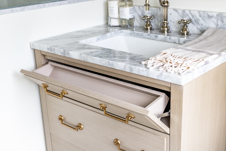 Guest bathroom renovation with storage vanity