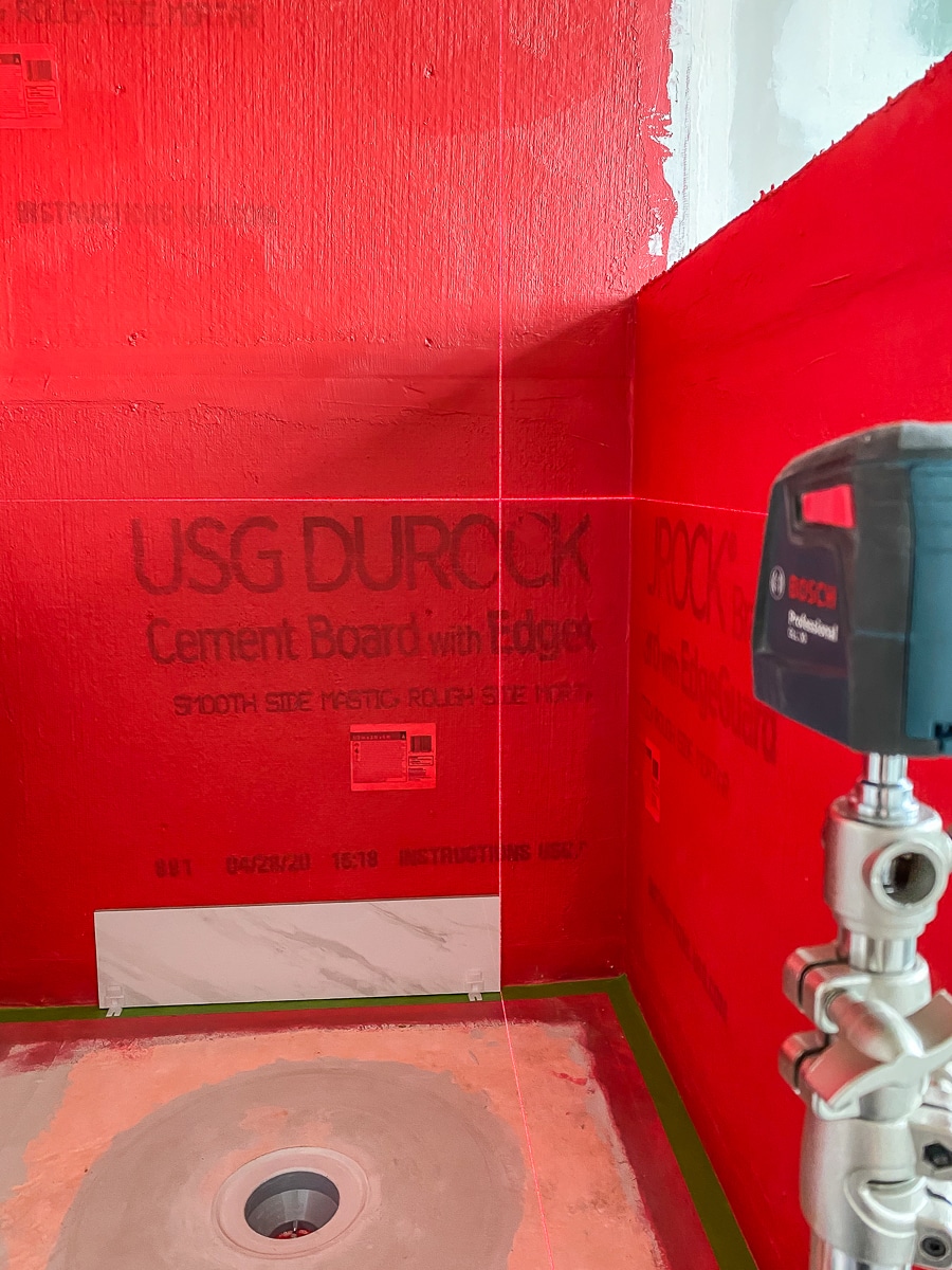 Using a laser level to install large format tiles