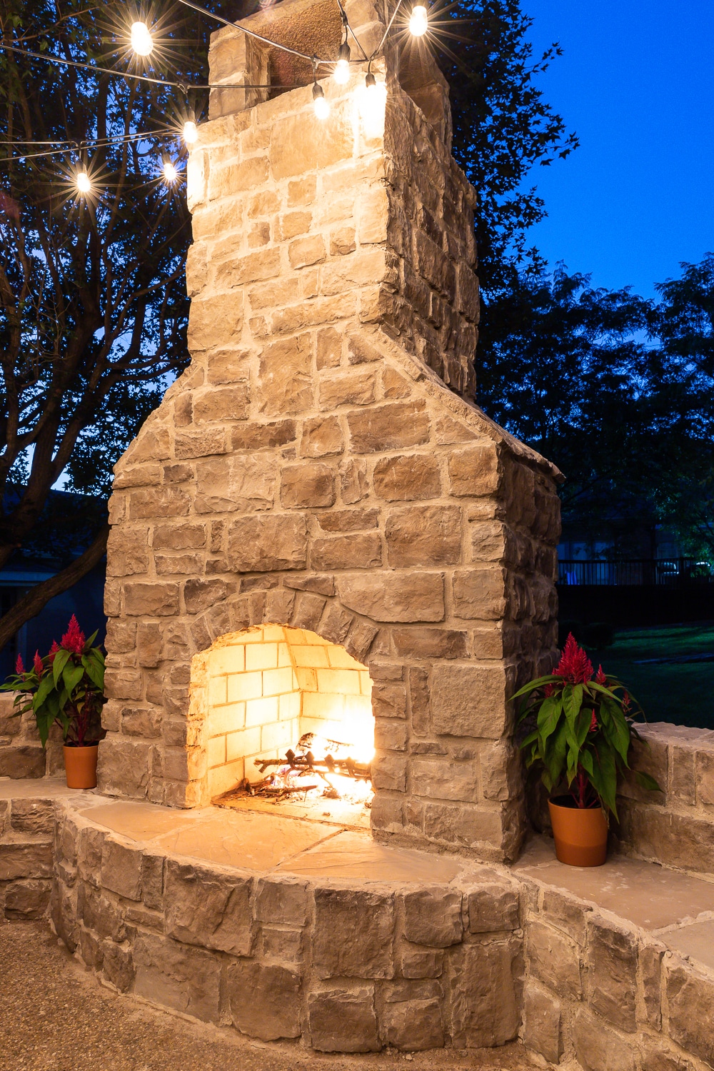 Outdoor fireplace with curved bench seating