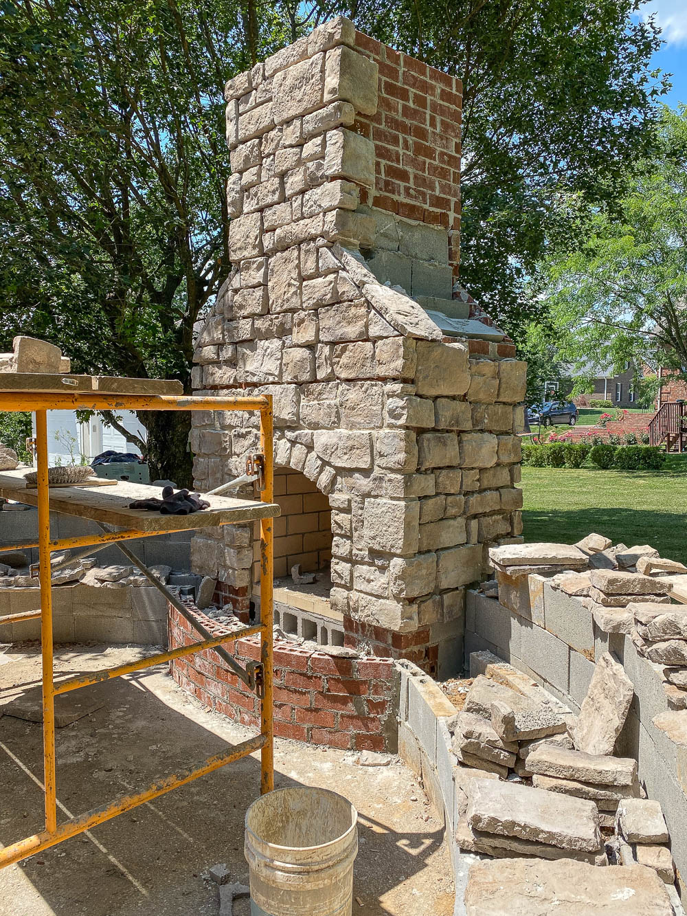 Adding the stone veneer to our outdoor fireplace