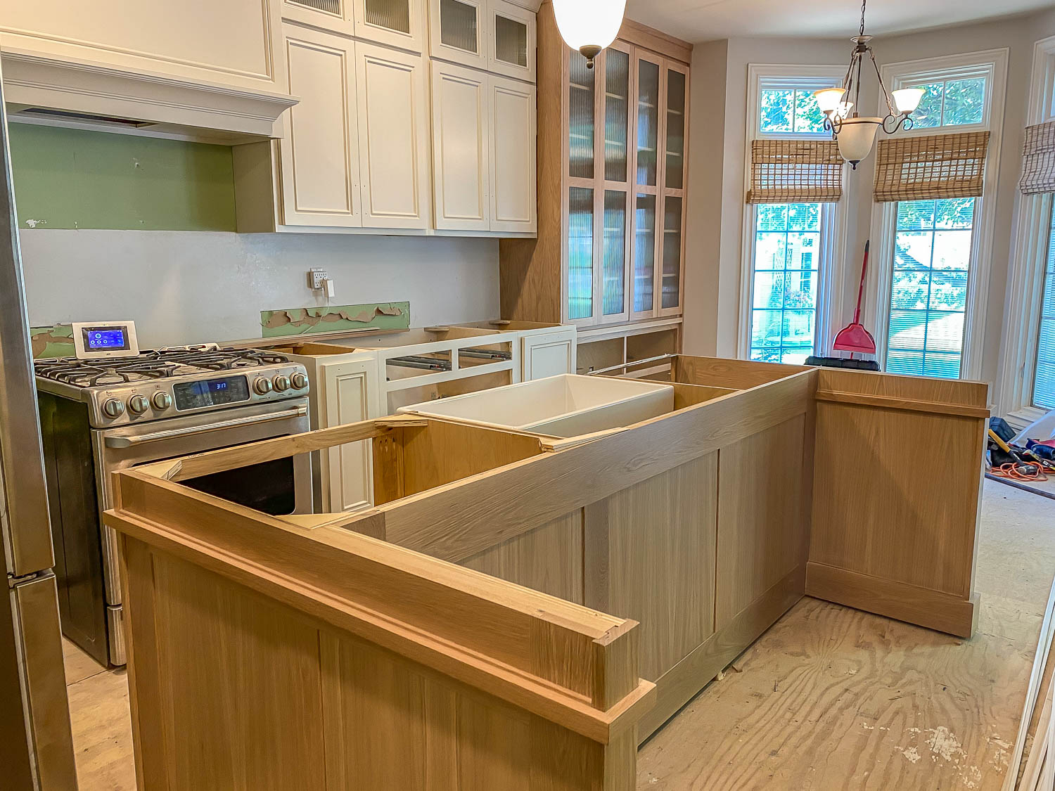 https://jenwoodhouse.com/wp-content/uploads/2021/10/kitchen-renovation-cabinet-install-5.jpg