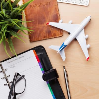 Business trip concept. Accessories on desk table