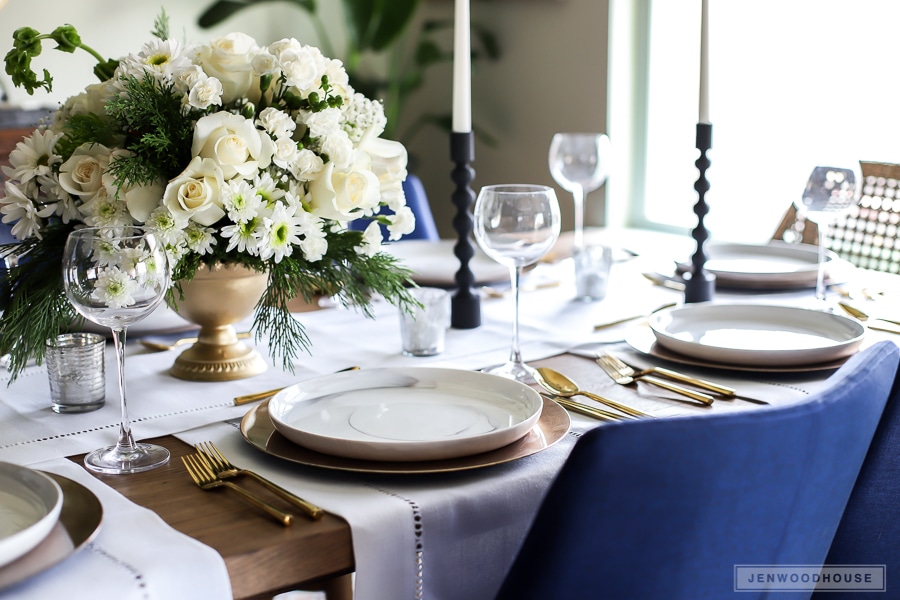 Wintery Christmas table setting with gold and white marble