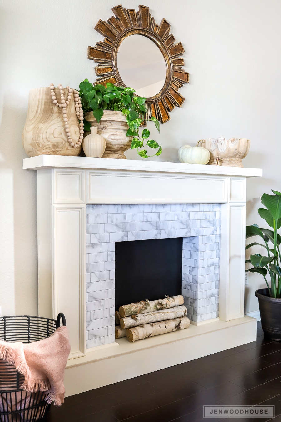 Build a DIY faux fireplace with adhesive tiles! Plans by Jen Woodhouse