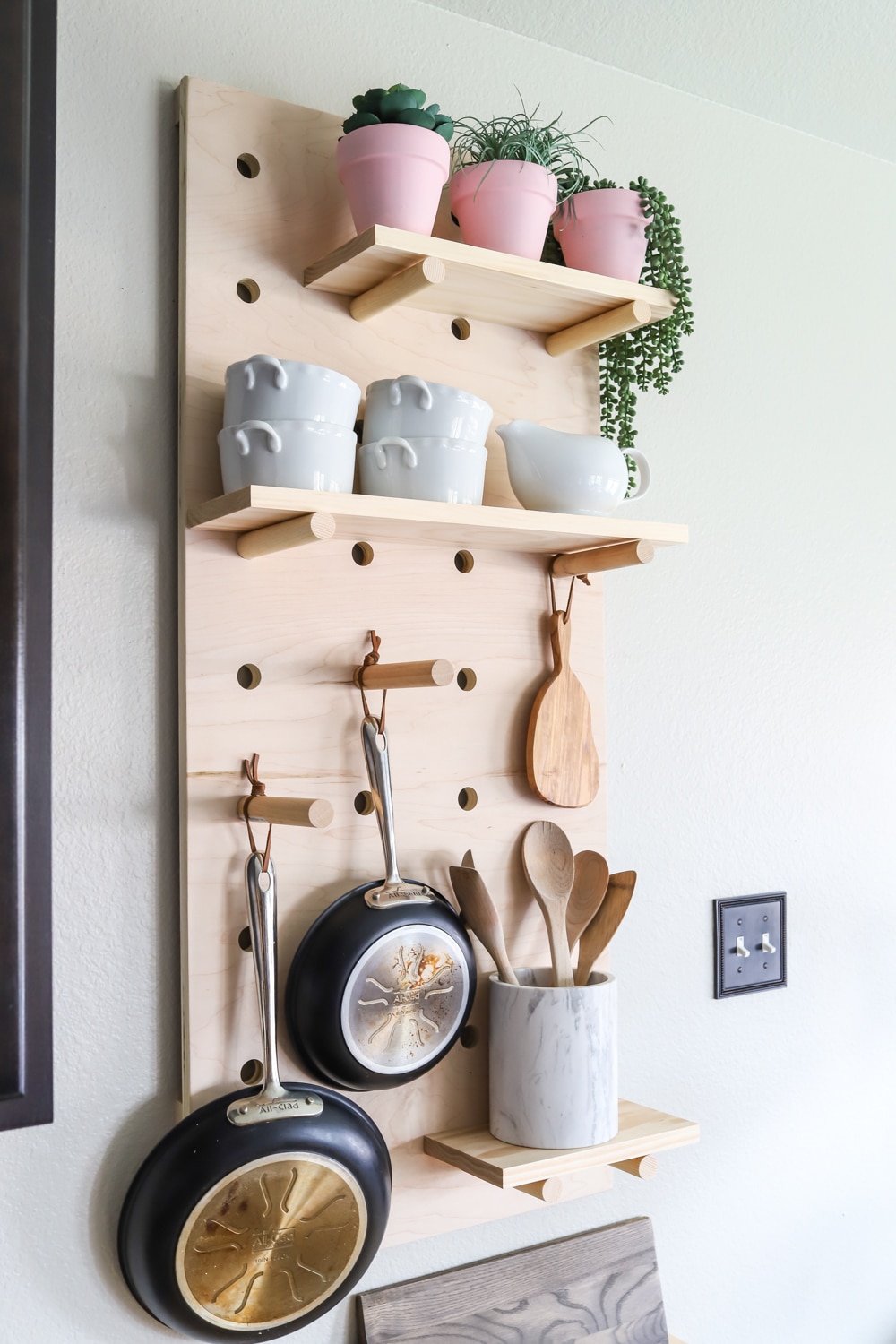 How to make a DIY pot rack from oversized pegboard shelves