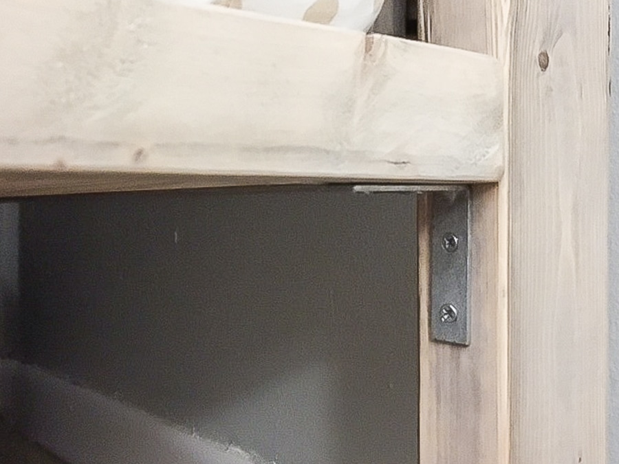 metal bed brackets on DIY toddler house bed