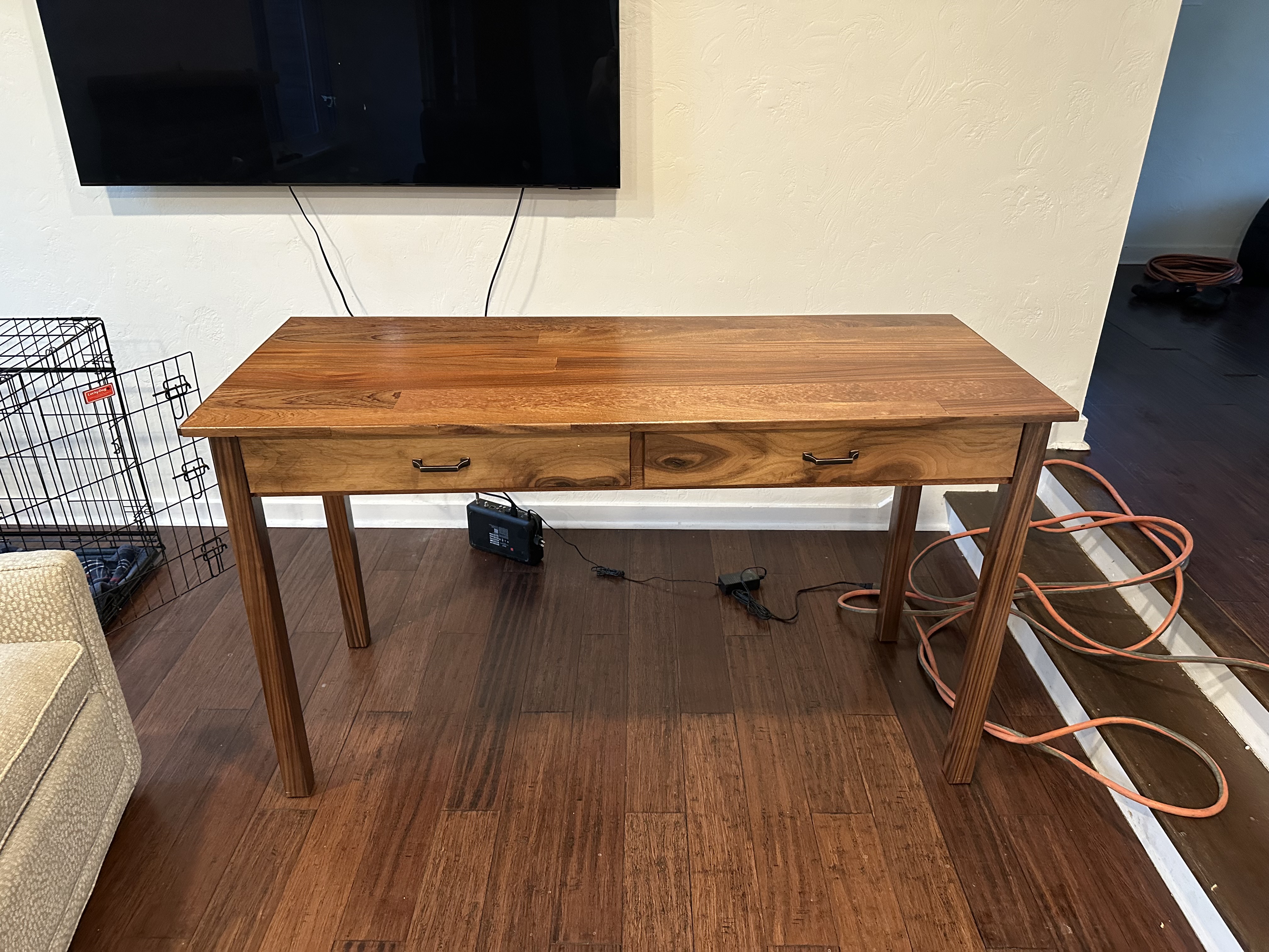 Mahogany desk with black walnut border, legs, and face plate