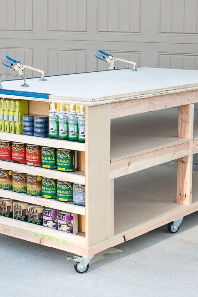 Learn how to build a DIY mobile workbench with shelves and storage for quarts of paint or stain. Add a clamp track to easy clamping capability.